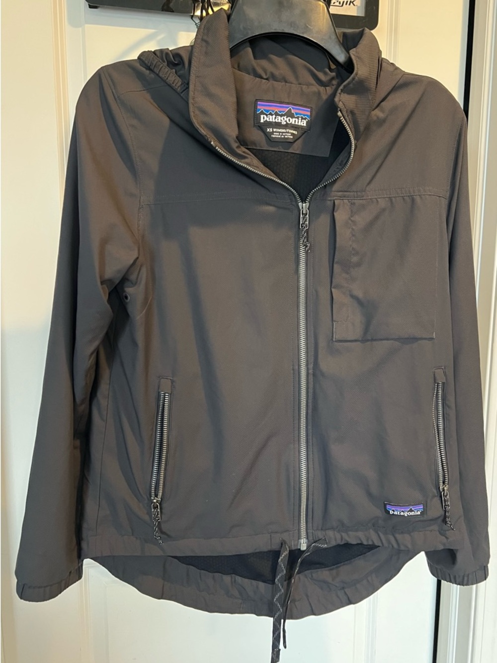 Patagonia women’s size XS Dark Gray Hooded Jacket with Multicolor Logo